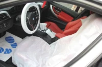 Kit protection intérieur de véhicule jetable